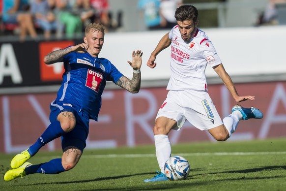 Le milieu valaisan Bastien Toma, droite, marque le deuxieme but faca au le joueur lucernois Marvin Schulz, gauche, lors de la rencontre de football de Super League entre le FC Sion et le FC Luzern le  ...