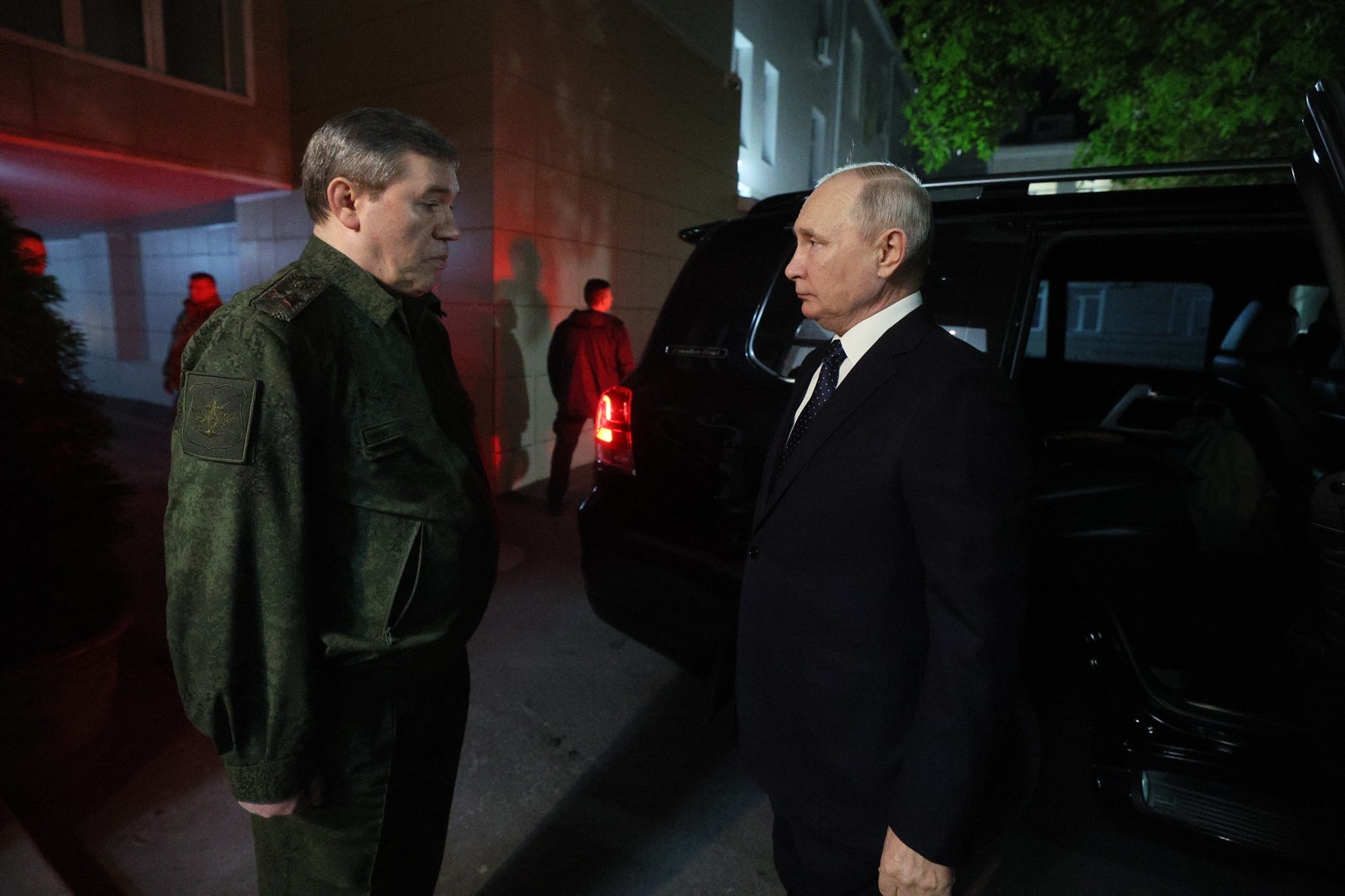 epa10928367 Russian President Vladimir Putin (R) meets with chief of the General Staff of the Armed Forces of the Russian Federation Valery Gerasimov walk in the headquarters of the Russian Armed Forc ...