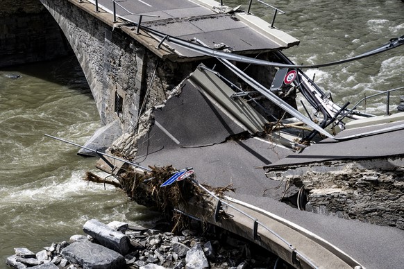 The collapsed Visletto bridge between Visletto and Cevio, in the Maggia Valley pictured after bad weather, in Visletto, Switzerland, Monday, July 1, 2024. Severe storms and torrential rain in Switzerl ...