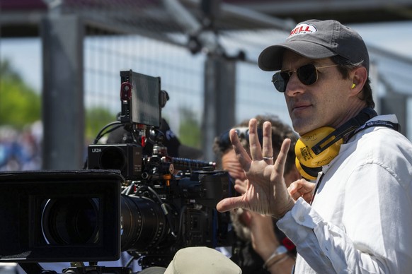 This image released by Apple TV+ shows filmmaker Joseph Kosinski on the set of &quot;F1 The Movie.&quot; (Apple TV+ via AP)
Film Review - F1 The Movie