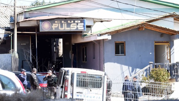 Police and investigators are seen in front of night club Pusle in Kocani North Macedonia. 59 people died and over 150 people were injured in a fire in night club Pulse in Kocani, , North Macedonia, Ma ...