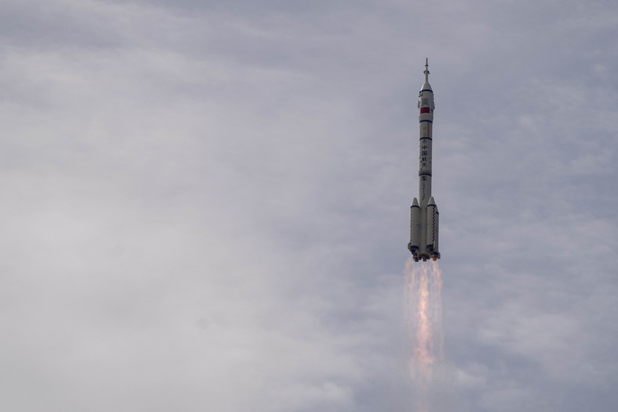 A Long March rocket carrying a crew of Chinese astronauts in a Shenzhou-16 spaceship lifts off at the Jiuquan Satellite Launch Center in northwestern China, Tuesday, May 30, 2023. (AP Photo/Mark Schie ...