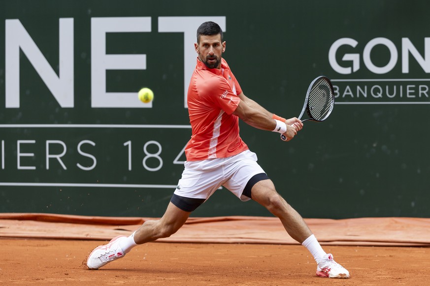 epa12123461 Novak Djokovic of Serbia in action against Marton Fucsovics of Hungary during their round of 16 match at the Geneva Open tennis tournament, in Geneva, Switzerland, 21 May 2025. EPA/CYRIL Z ...