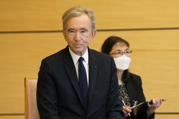 epa09922177 LVMH Moet Hennessy Louis Vuitton CEO Bernard Arnault waits for Japanese Chief Cabinet Secretary Hirokazu Matsuno (not pictured) at the Prime Minister?s Office in Tokyo, Japan, 02 May 2022. ...