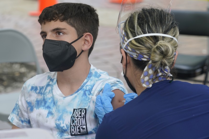 Andres Veloso, 12, gets the first dose of the Pzifer COVID-19 vaccine, Monday, Aug. 9, 2021, in Miami. Florida is reporting a surge of COVID-19 cases caused by the highly contagious delta variant. (AP ...
