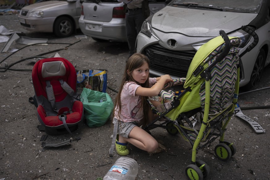 Polina, 10, looks after her sister Marina, 3, at the site of Okhmatdyt children&#039;s hospital hit by Russian missiles, in Kyiv, Ukraine, Monday, July 8, 2024. A major Russian missile attack across U ...