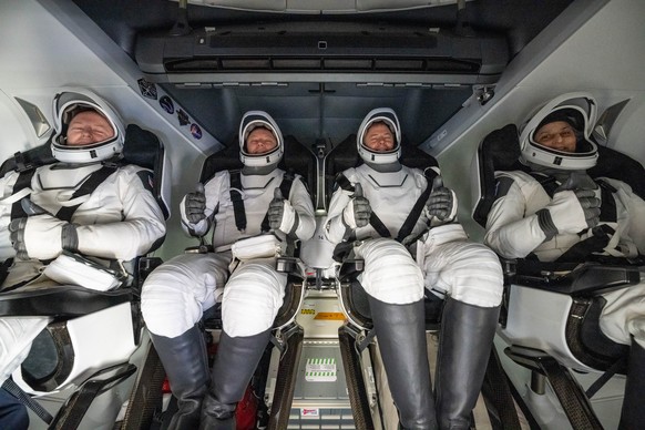 epa11972894 (L-R) NASA astronaut Butch Wilmore, Roscosmos cosmonaut Aleksandr Gorbunov, and NASA astronauts Nick Hague, and Suni Williams are seen inside a SpaceX Dragon spacecraft onboard the SpaceX  ...