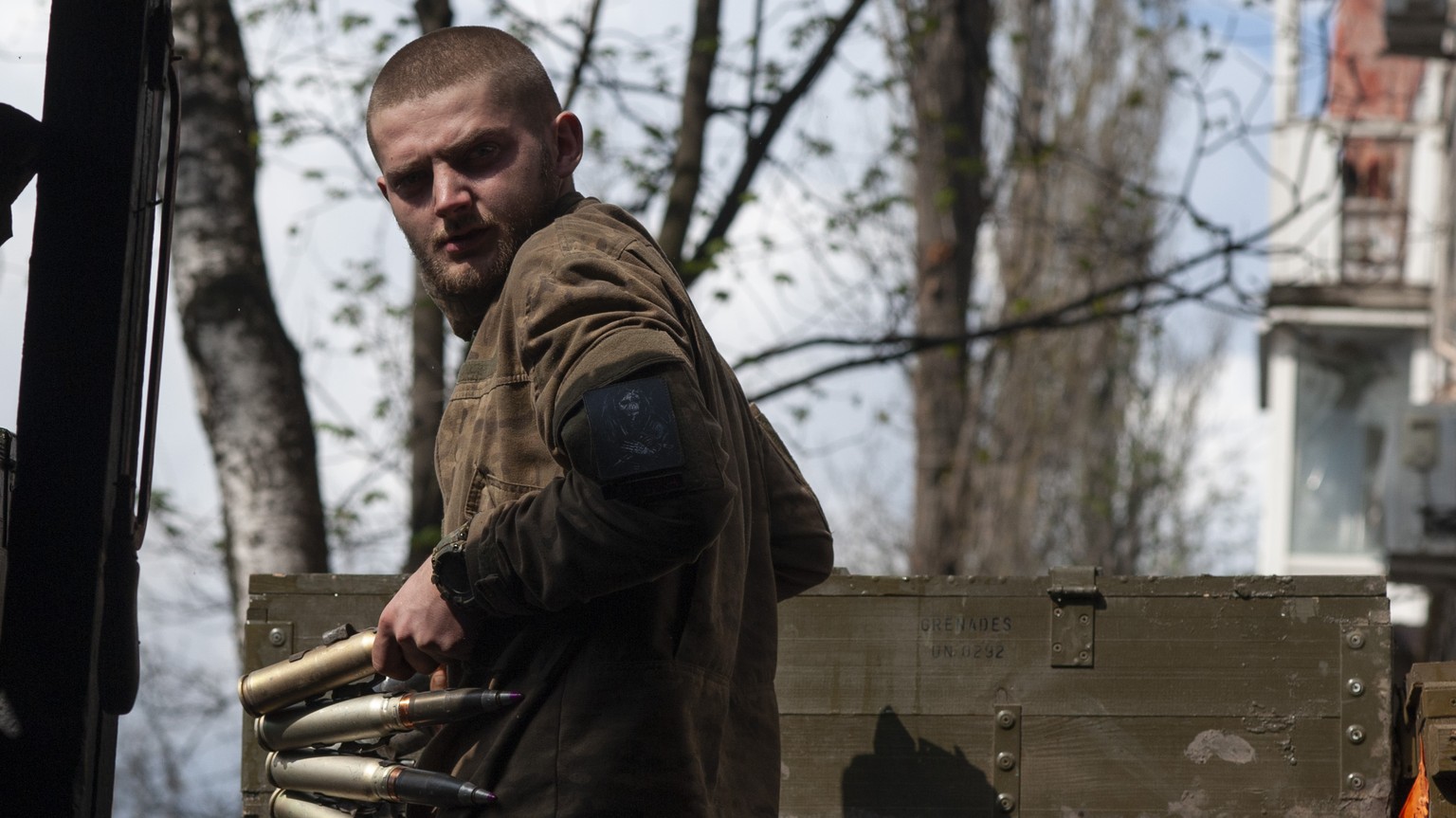 FILE - A Ukrainian soldier carries cartridges in war-hit Bakhmut, Donetsk region, Ukraine, Sunday, April 23, 2023. Ukrainian President Volodymyr Zelenskyy said Sunday, May 21, 2023 that Russian forces ...