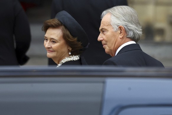 Former British Prime Minister Tony Blair and his wife Cherie walk outside the Westminster Abbey on the day of Queen Elizabeth II funeral, in London Monday, Sept. 19, 2022. (Hannah McKay/Pool Photo via ...