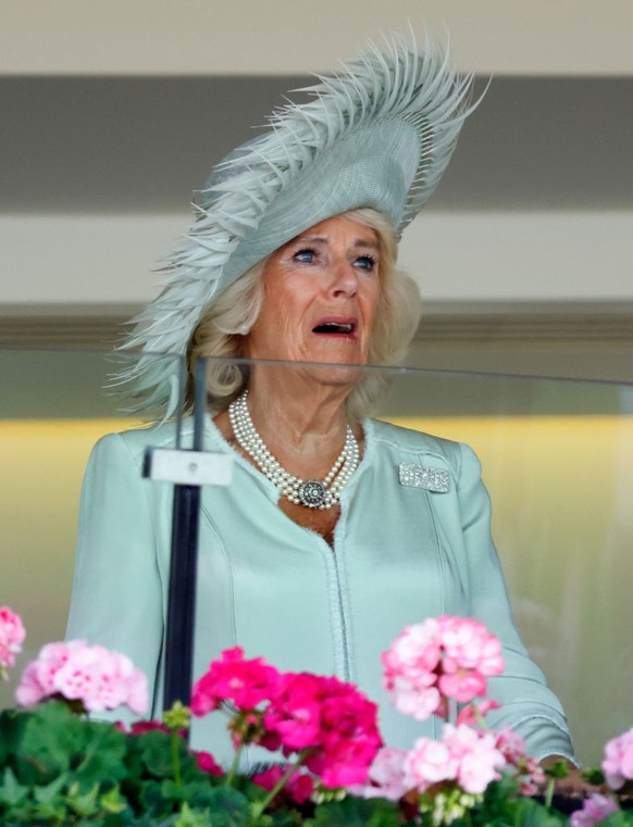 ASCOT, UNITED KINGDOM - JUNE 22: (EMBARGOED FOR PUBLICATION IN UK NEWSPAPERS UNTIL 24 HOURS AFTER CREATE DATE AND TIME) Queen Camilla is visibly emotional after her horse 'Desert Hero' (whic ...
