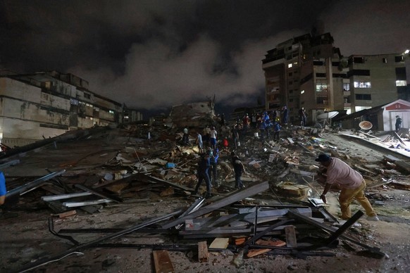 Rescue workers search through the rubble after an earthquake in Caracas, Venezuela, Wednesday, June 24, 2026. (AP Photo/Javier Campos)
Venezuela Earthquake