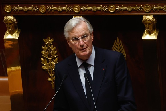 epa11753356 French Prime Minister Michel Barnier delivers a speech as part of the French National Assembly debate on parts of France&#039;s 2025 budget bill, in Paris, France, 02 December 2024. Prime  ...