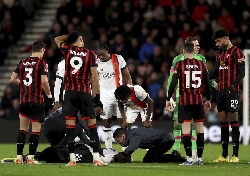 Luton Town&#039;s Tom Lockyer receives treatment on the pitch during the English Premier League soccer match between Bournemouth and Luton Town at the Vitality Stadium, in Bournemouth, England, Saturd ...