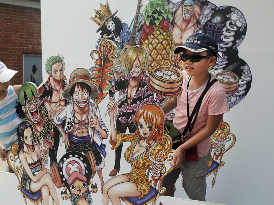 Des enfants posent avec des personnages issus de One Piece (image d&#039;illustration).