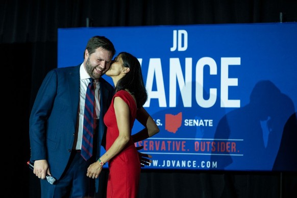 CINCINNATI, OH - MAY 3: Republican U.S. Senate candidate J.D. Vance receives a kiss from his wife Usha Vance after winning the primary, at an election night event at Duke Energy Convention Center on M ...