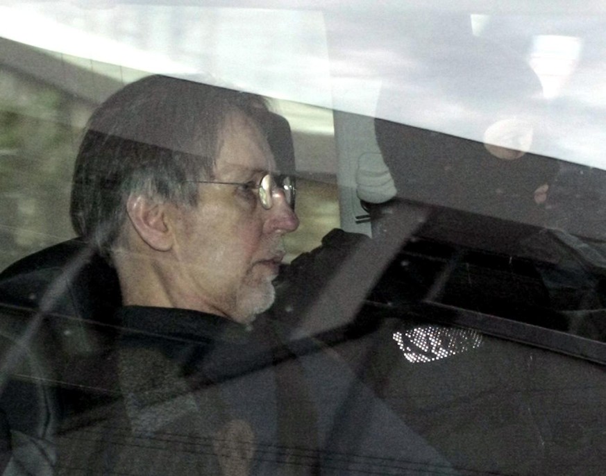 ** FILE ** Michel Fourniret, left, a French man accused of the serial murders of seven women and girls, is driven back under heavy police protection to the Charleville-Mezieres courthouse, northern Fr ...