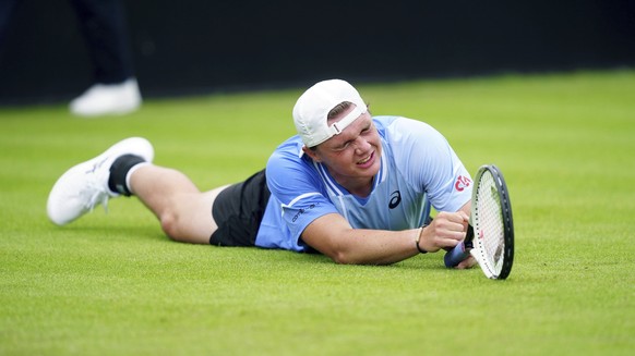 CORRECTS NATIONALITY Switzerland&#039;s Dominic Stricker appears injured during his men&#039;s singles match against Britain&#039;s Daniel Evans on day two of the Rothesay Open at the Lexus Nottingham ...