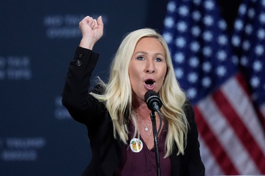 FILE - Rep. Marjorie Taylor Greene, R-Ga., speaks before Republican presidential nominee former President Donald Trump at a campaign event at the Cobb Energy Performing Arts Centre, Oct. 15, 2024, in  ...