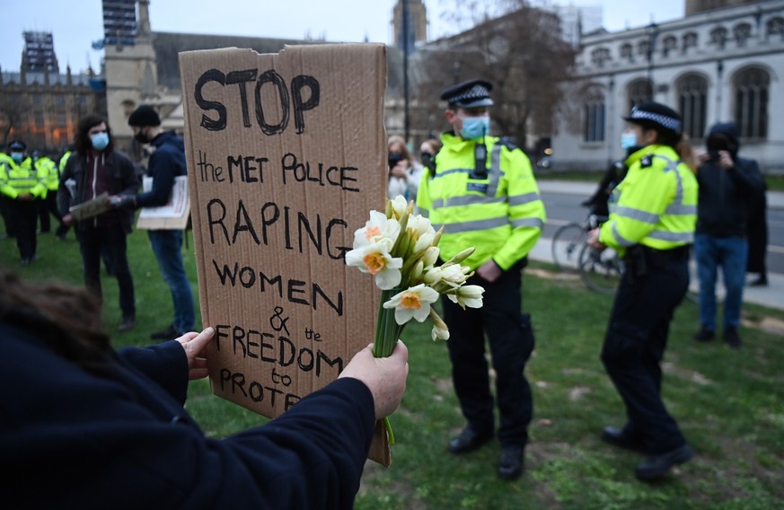 epaselect epa09074370 Protesters demonstrate outside parliament against police brutality in London, Britain, 14 March 2021. Thousands of people had attended a Reclaim These Streets vigil for Sarah Eve ...