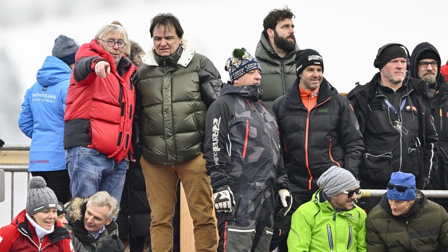 Former Swiss ski racer Roland Collombin, center left, speaks to Swiss soccer team FC Sion president and owner Christian Constantin, center right, next to former Swiss ski racer Didier Defago, 3rd righ ...