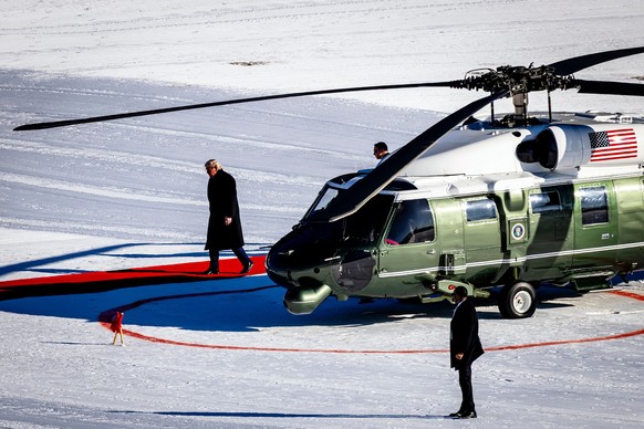US President Donald Trump walks out of the Marine One helicopter as he arrives for the 56th annual meeting of the World Economic Forum, WEF, in Davos, Switzerland, Wednesday, Jan. 21, 2026. (Michael B ...