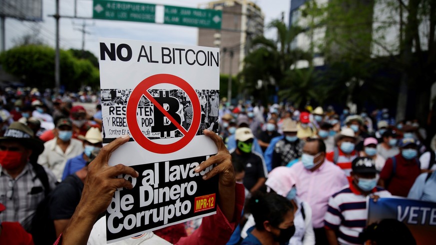epa09432638 Former guerrillas and veterans of the Army of El Salvador protest against the use of bitcoin as legal currency, in San Salvador, El Salvador, 27 August 2021. A group of ex-guerrillas and v ...
