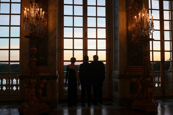 U.S. President Donald Trump, right, receives a tour of Chateau de Versailles from President Emmanuel Macron and his wife, Brigitte Macron, ahead of a dinner on Wednesday, June 17, 2026 in Versailles, ...