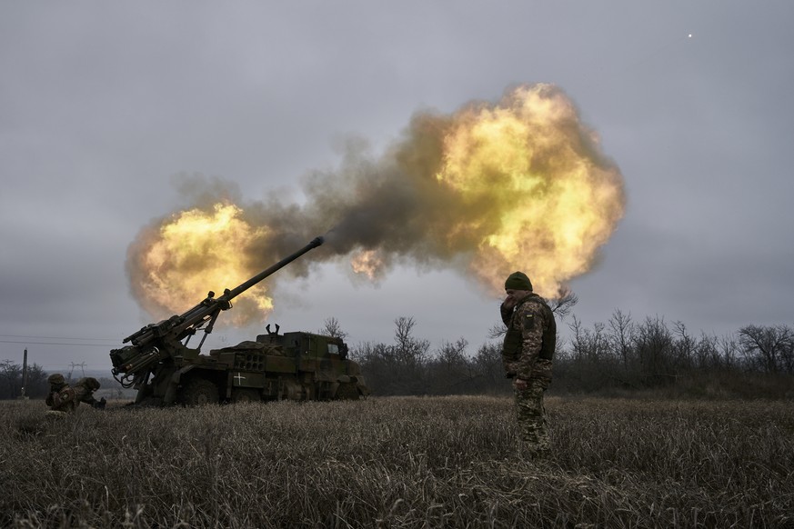 FILE - Ukrainian soldiers fire a French-made CAESAR self-propelled howitzer towards Russian positions near Avdiivka, Donetsk region, Ukraine, Monday, Dec. 26, 2022. French manufacturers have halved or ...