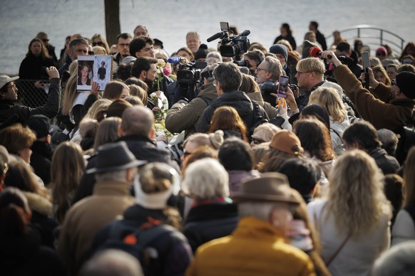 epa12694962 Parents of victims talk to the media as about a thousand people gather to pay tribute to the victims of the tragedy in Crans-Montana and to call for justice and truth, Lutry, Switzerland,  ...