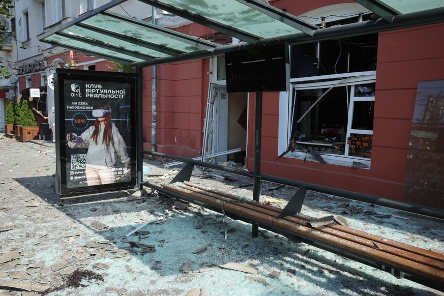 CHERNIHIV, UKRAINE - AUGUST 19: Shattered glass and debris litter a public transport stop in front of a restaurant damaged by Russian shelling on August 19, 2023 in Chernihiv, Ukraine. The number of p ...
