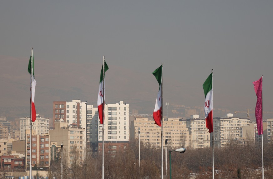 epa11783977 Smog obscures the skyline in Tehran, Iran, 18 December 2024. Following heavy air pollution and cold weather which cause also energy crisis in Iran and the capital city of Tehran, Iranian g ...
