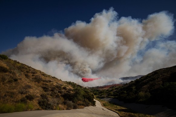 An air tanker drops retardant on the Sandy Fire on Monday, May 18, 2026, in Simi Valley, Calif. (AP Photo/Ethan Swope)
California Wildfires