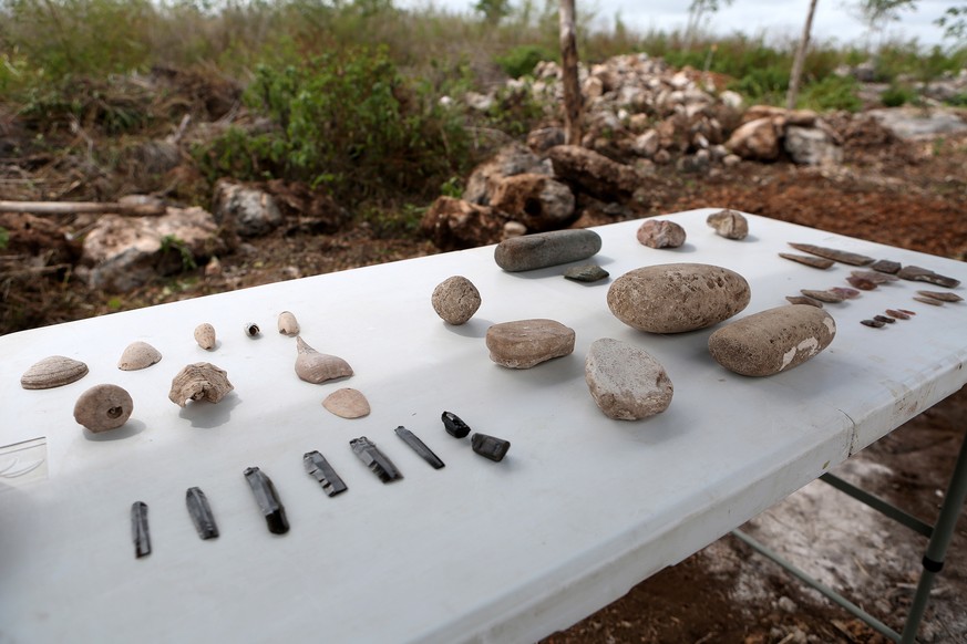 epa09980531 Tools found in the Mayan archaeological zone of Xiol, near the municipality of Kanasin, state of Yucatan, Mexico, 26 May 2022 (issued 27 May 2022). In the middle of the jungle of Yucatan,  ...