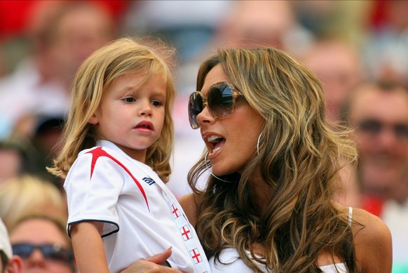 FRANKFURT, GERMANY - June 10: Romeo Beckham and Victoria Beckham in the crowd before the FIFA World Cup Finals 2006 Group B match between England and Paraguay at Waldstadion on June 10, 2006 in Frankf ...