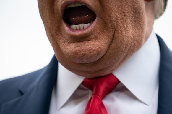 WASHINGTON, DC - MAY 14: U.S. President Donald Trump speaks to reporters on his way to Marine One on the South Lawn of the White House on May 14, 2020 in Washington, DC. President Trump is traveling t ...
