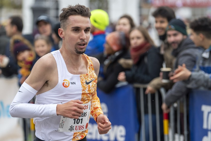 Julien Wanders of Switzerland in action before celebrates his victory of the men's elite category, during the 42st Escalade Race (Course de l'Escalade) in Geneva, Switzerland, on Sunday, Dec ...
