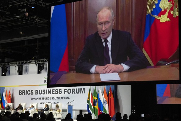 Russian President Vladimir Putin addresses leaders from the BRICS group of emerging economies at the start of a three-day summit in Johannesburg, South Africa , Tuesday, Aug. 22, 2023. Putin appeared  ...