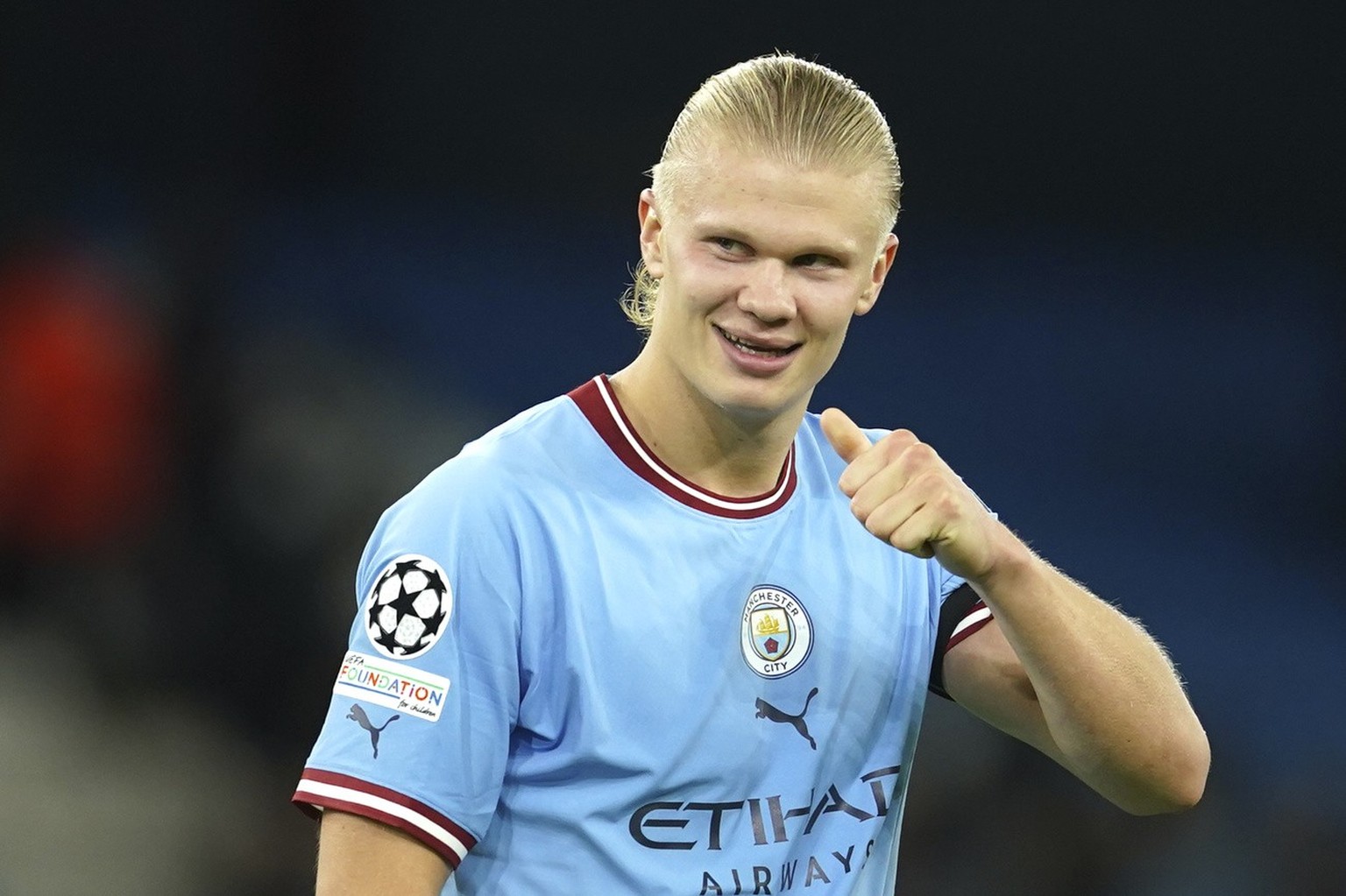 Manchester City&#039;s Erling Haaland celebrates at the end of the group G Champions League soccer match between Manchester City and Borussia Dortmund at the Etihad stadium in Manchester, England, Wed ...