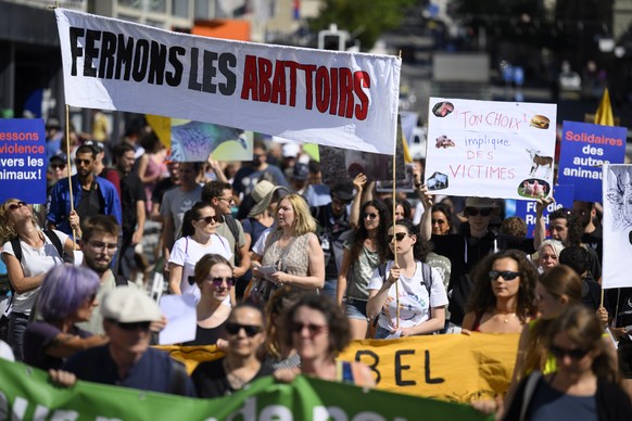 epa10141714 Anti-speciesism activists hold banners and posters, during a march for the 8th World Day for the End of Speciesism (WoDES), in Lausanne, Switzerland, 27 August 2022. The World Day for the  ...