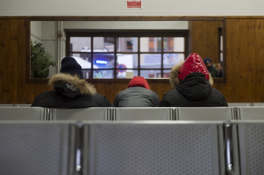 A group of refugees in the waiting room of the railway station of Bardonecchia in Bardonecchia, Italy, on 18 January, 2018. The Italian community Bardonecchia in the upper Susa Valley in the Piedmont  ...
