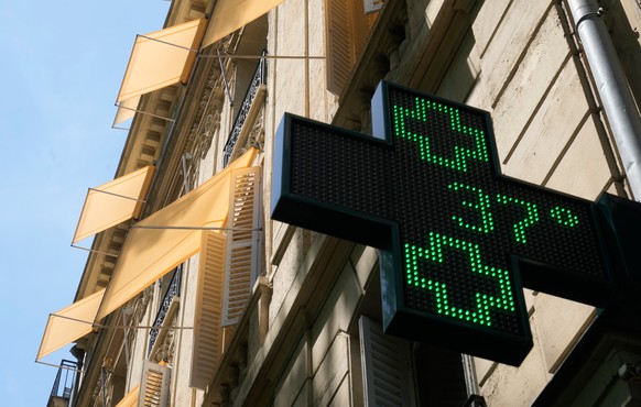 A sign outside a pharmacy displays a temperature of 37 degrees Celsius (98.6 degrees Fahrenheit) in Paris, Sunday, June 21, 2026.
France Extreme Weather Heat