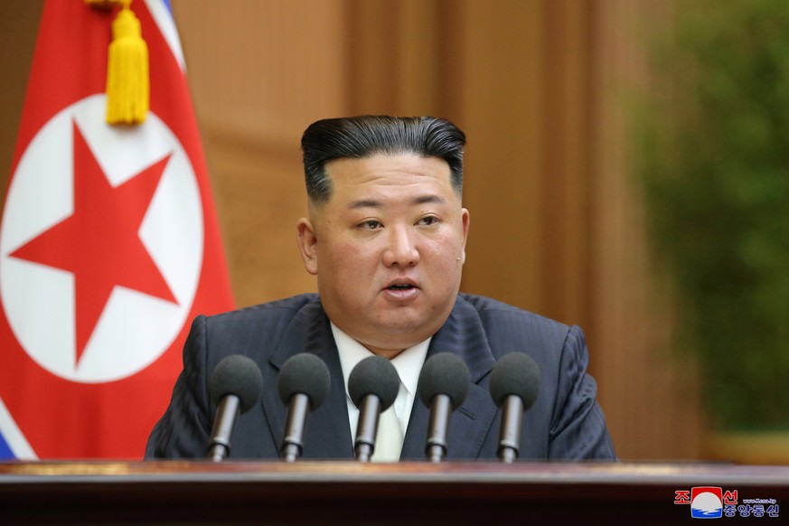 epa10172315 A photo released by the official North Korean Central News Agency (KCNA) shows North Korean leader Kim Jong-un delivering his speech during a parliament session in Pyongyang, North Korea,  ...