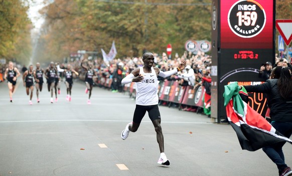 Kenya&#039;s Eliud Kipchoge, the marathon world record holder, crosses the finish line during his attempt to run a marathon in under two hours in Vienna, Austria, October 12, 2019. REUTERS/Lisi Niesne ...