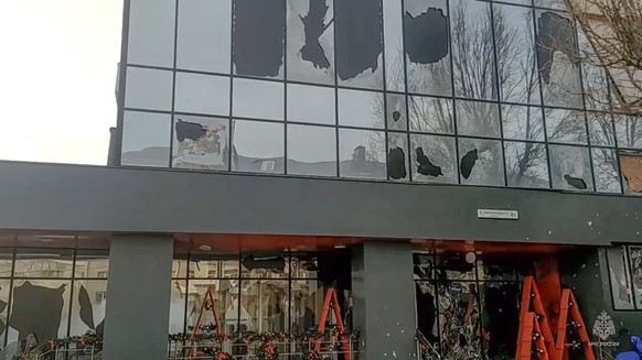 In this photo taken from video released by Russia Emergency Situations Ministry telegram channel on Saturday, Dec. 30, 2023, a building damaged after shelling is seen in Belgorod, Russia. Russian offi ...