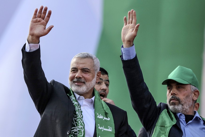 epa11531420 (FILE) Top Hamas leader Sheikh Ismail Haniyeh (L) and leader of Hamas movement in Gaza Strip Yahya Al Sinwar (R) attend a Hamas rally to mark the group&#039;s 30th anniversary, in Gaza Cit ...