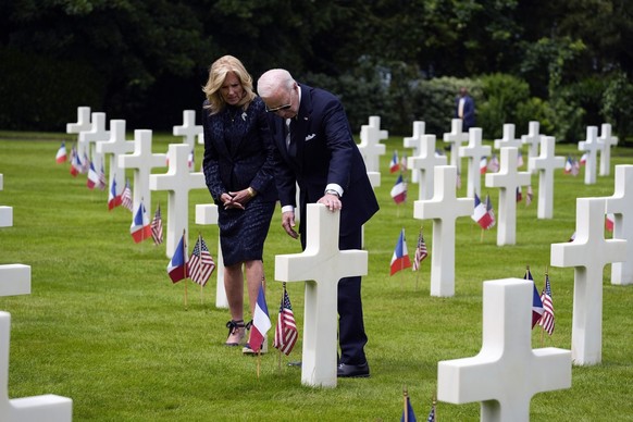 THE GRAVE SHOWN MAY NOT BE PRIVATE FIRST CLASS JOHN GREENFIELD'S GRAVE - President Joe Biden and first lady Jill Biden, visit the graves at the Normandy American Cemetery after a ceremony to mark ...