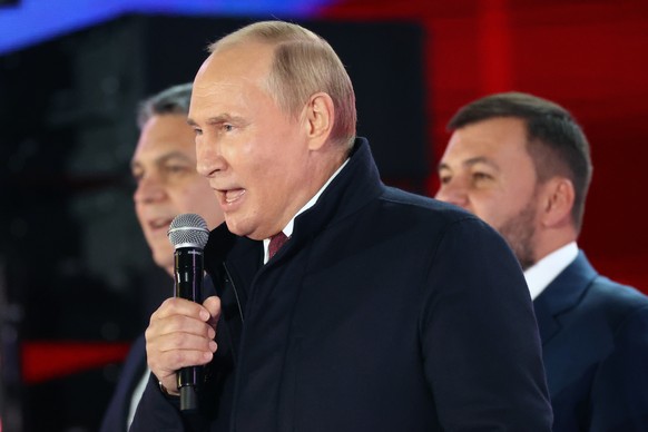 Russian President Vladimir Putin speaks as Leonid Pasechnik, leader of self-proclaimed Luhansk People&#039;s Republic, left, and Denis Pushilin, leader of self-proclaimed of the Donetsk People&#039;s  ...