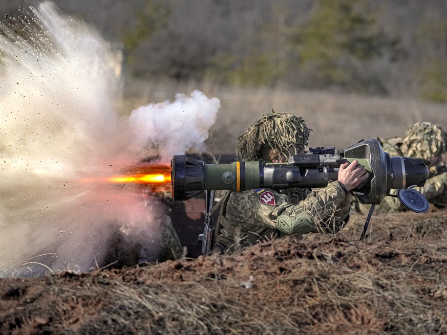 FILE - A Ukrainian serviceman fires an NLAW anti-tank weapon during an exercise in the Joint Forces Operation, in the Donetsk region, eastern Ukraine, on Feb. 15, 2022. Western weaponry pouring into U ...