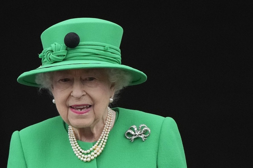 Queen Elizabeth II stands on the balcony during the Platinum Jubilee Pageant at the Buckingham Palace in London, Sunday, June 5, 2022