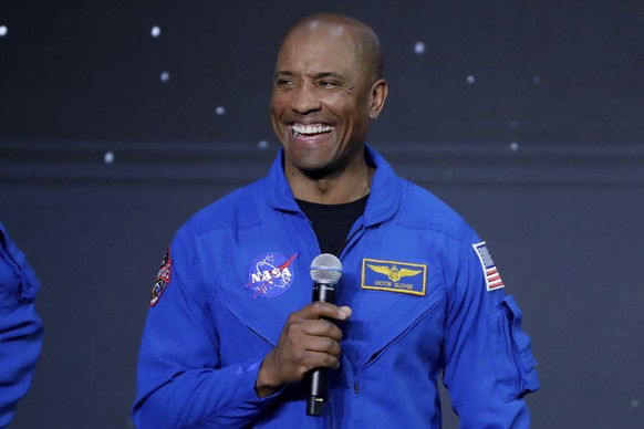 Victor Glover gives remarks after he was announced at the mission pilot for the Artemis II during a NASA ceremony naming the four astronauts who will fly around the moon by the end of next year on the ...